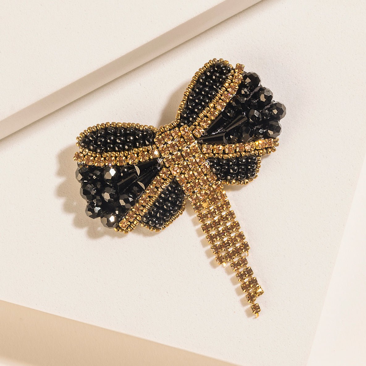 Myra Evening Grace Bow Brooch in Gilded Gold - Image 2
